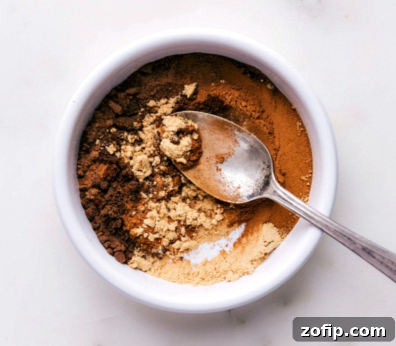 Mixing together a blend of spices to show how to make pumpkin pie spice.