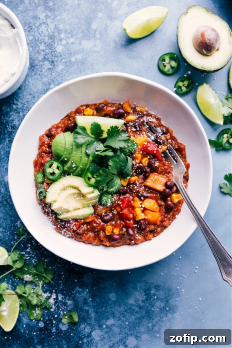 A vibrant bowl of Slow Cooker Mexican Quinoa, garnished with fresh cilantro and a dollop of sour cream, ready to be enjoyed.