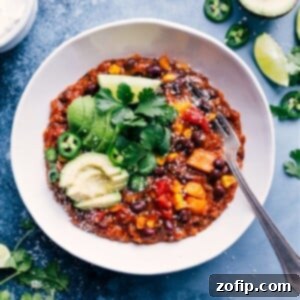 A vibrant bowl of Slow Cooker Mexican Quinoa, garnished with fresh cilantro and a dollop of sour cream, ready to serve.