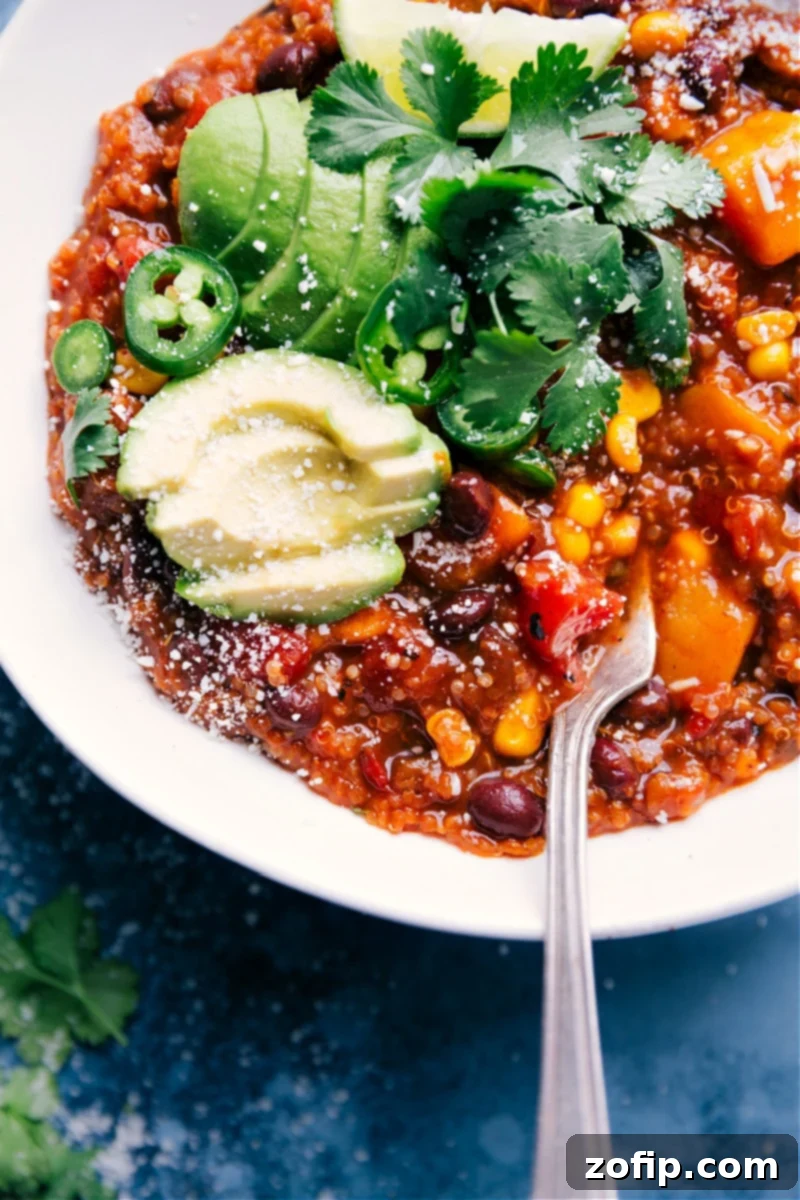 A beautifully presented serving of freshly prepared Slow Cooker Mexican Quinoa in a white bowl, garnished with cilantro and ready to be enjoyed as a healthy meal.