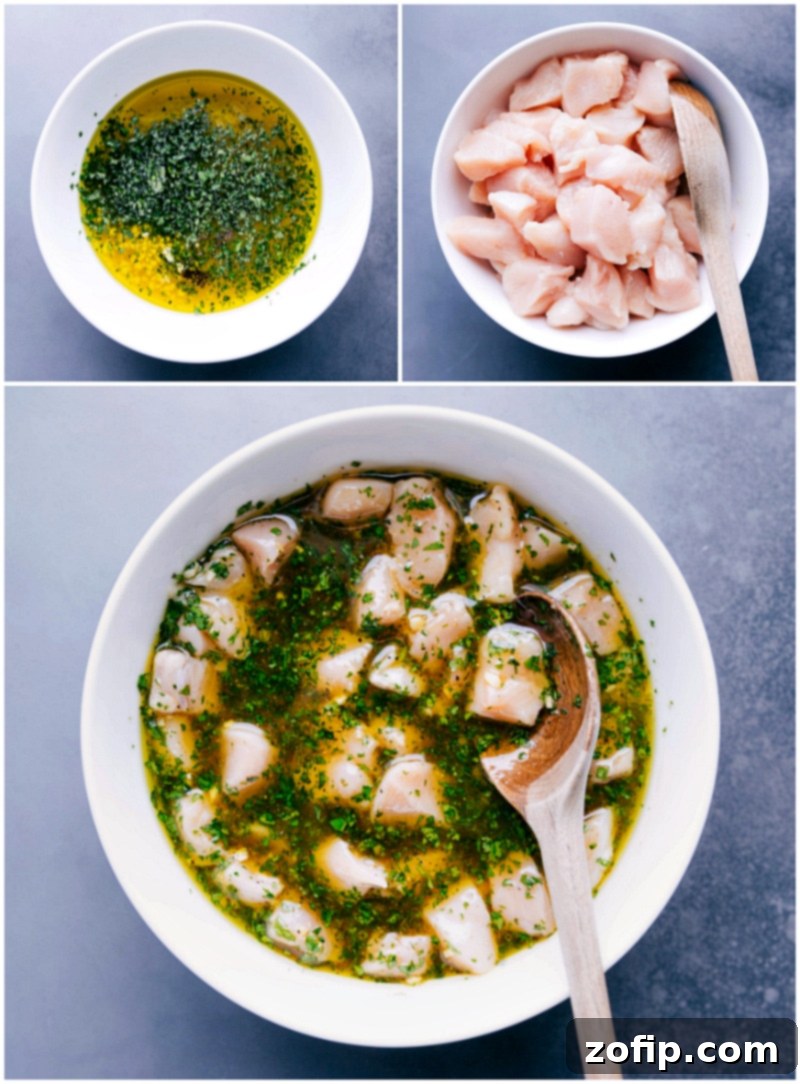 A large bowl containing chopped chicken marinating in a flavorful, zesty sauce, showcasing the marinade preparation process before grilling.