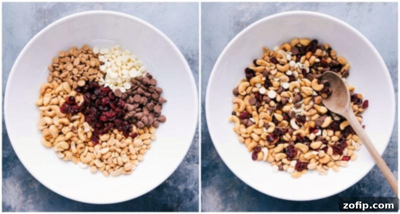 Ingredients for the indulgent trail mix recipe including chocolate chips, golden raisins, dried cherries, and more, being stirred together in a bowl.