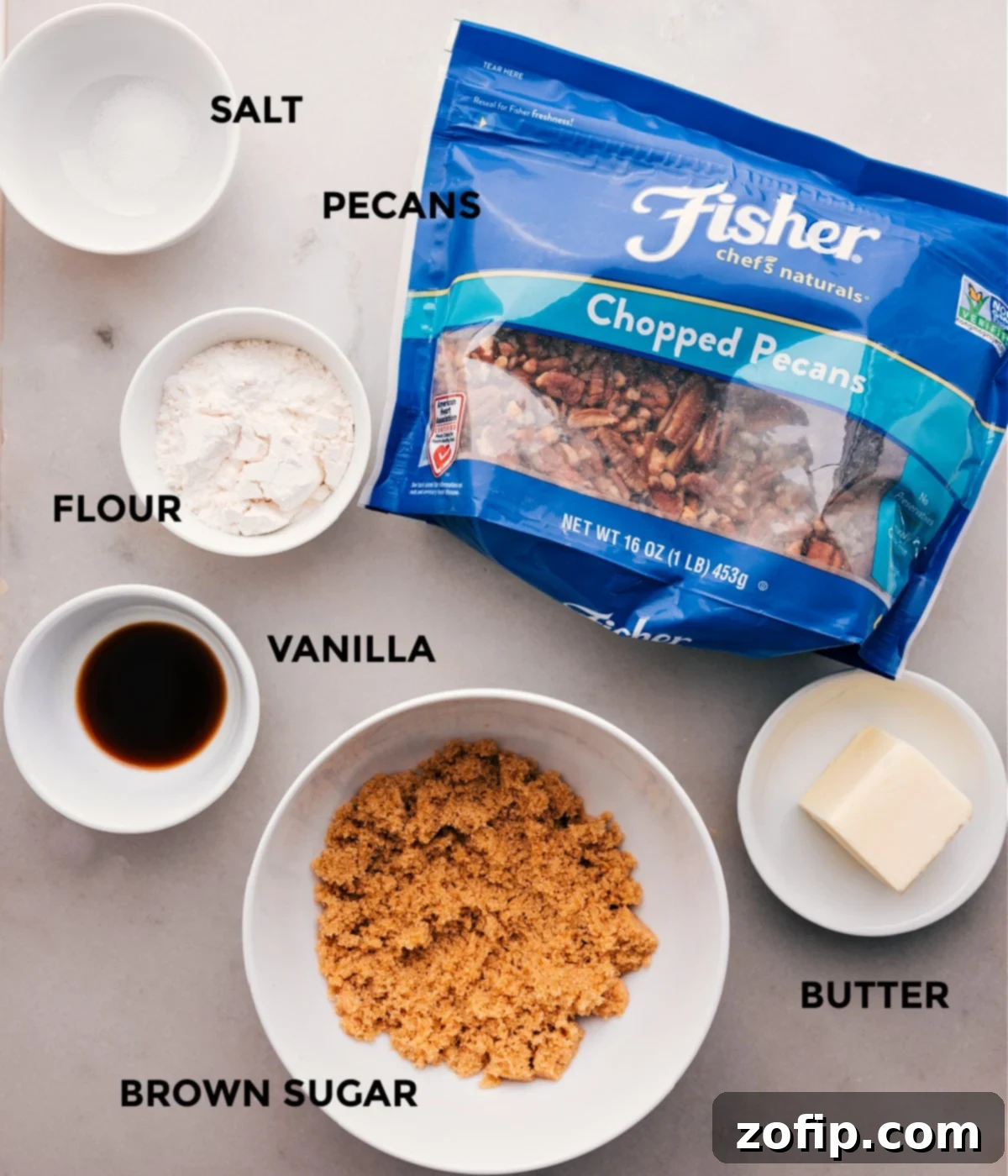 The topping ingredients for this Crockpot Sweet Potato Casserole are prepped: finely chopped pecans, flour, vanilla extract, brown sugar, and softened butter.