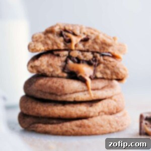 A stack of mouthwatering caramel snickerdoodles with centers oozing with melting caramel and chocolate.