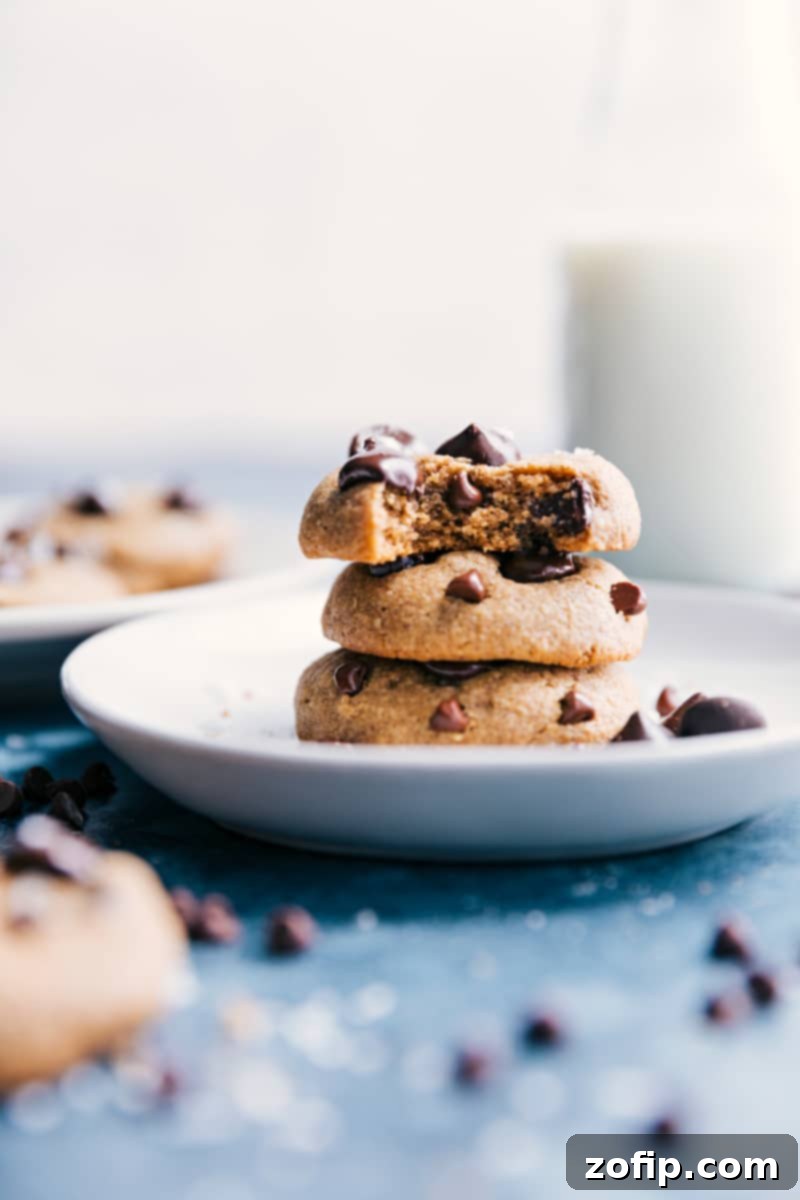 Healthy Chocolate Chip cookies stacked on a plate, showcasing their perfect texture and inviting golden brown edges.