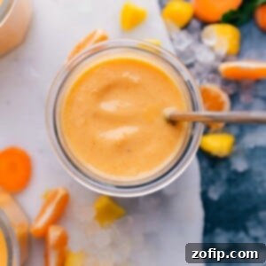 Vibrant Immunity Smoothie 3 Immune boosting Smoothie surrounded by vibrant sliced fruit, a nutritious and colorful ensemble.