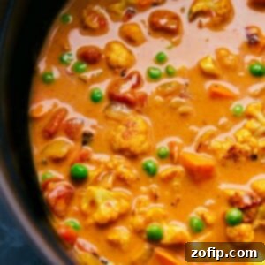 Spiced Vegetable Medley 2 A hearty pot of vegetable curry brimming with colorful vegetables and simmered in a coconut curry broth.