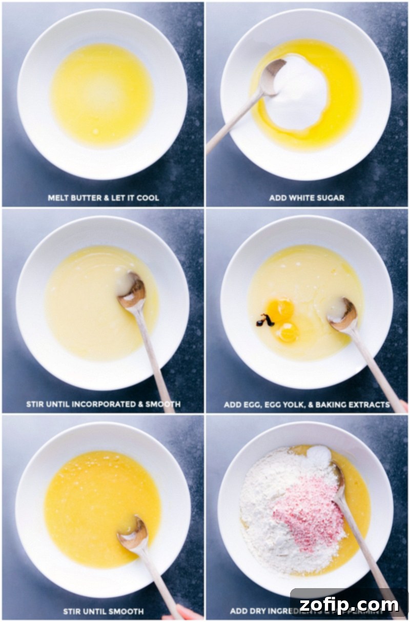 Soft and chewy Peppermint Sugar Cookies with a creamy peppermint-flavored frosting and crushed peppermint candy on top are the perfect holiday treat! Recipe via chelseasmessyapron #recipe #chewy #soft #decorated #withcreamcheesefrosting #easy #christmas #frosting #best #simple #dessert #holidays #peppermint #sugar #sugarcookies #cookies Wet ingredients being mixed together before dry ingredients are gently added, highlighting the cookie dough preparation.