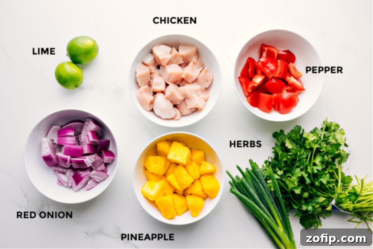 All the fresh ingredients meticulously prepped for easy assembly of teriyaki chicken skewers, including bright red onions, juicy pineapple chunks, succulent chicken pieces, fresh herbs, and colorful bell peppers.