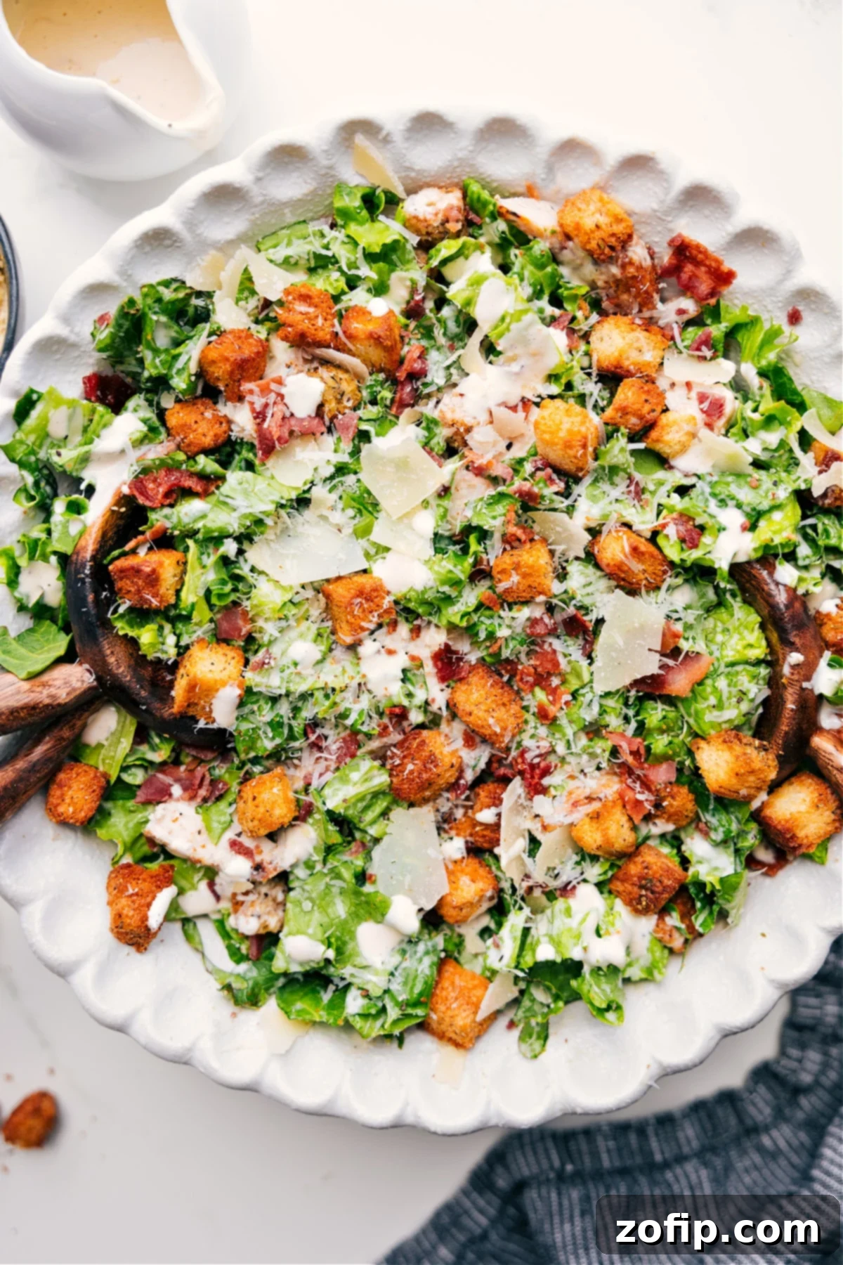 A vibrant Caesar Salad presented in a rustic bowl, perfectly dressed with generous Parmesan shavings and golden croutons, ready to be enjoyed.