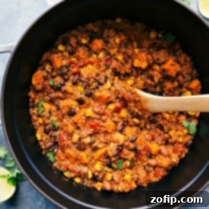 Hearty Quinoa Chili 2 The delicious, warm, and hearty finished Quinoa Chili meal, presented in a rustic pot, ready to be enjoyed by everyone.