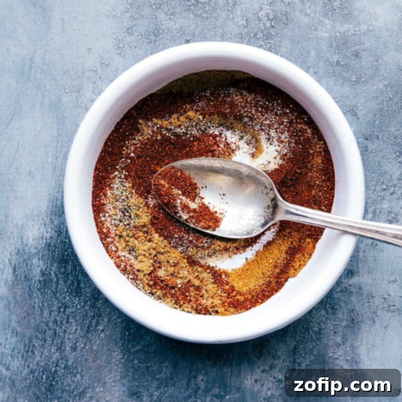 Seasoning Mix for Quinoa Chili Recipe - Flavorful and Aromatic A vibrant mix of chili powder, ground cumin, cayenne pepper, onion powder, garlic powder, salt, and pepper, showcasing the essential seasoning blend for this flavorful quinoa chili recipe.