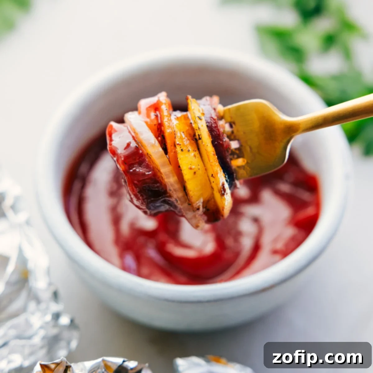 A bite of the hobo foil packets dipped in ketchup.