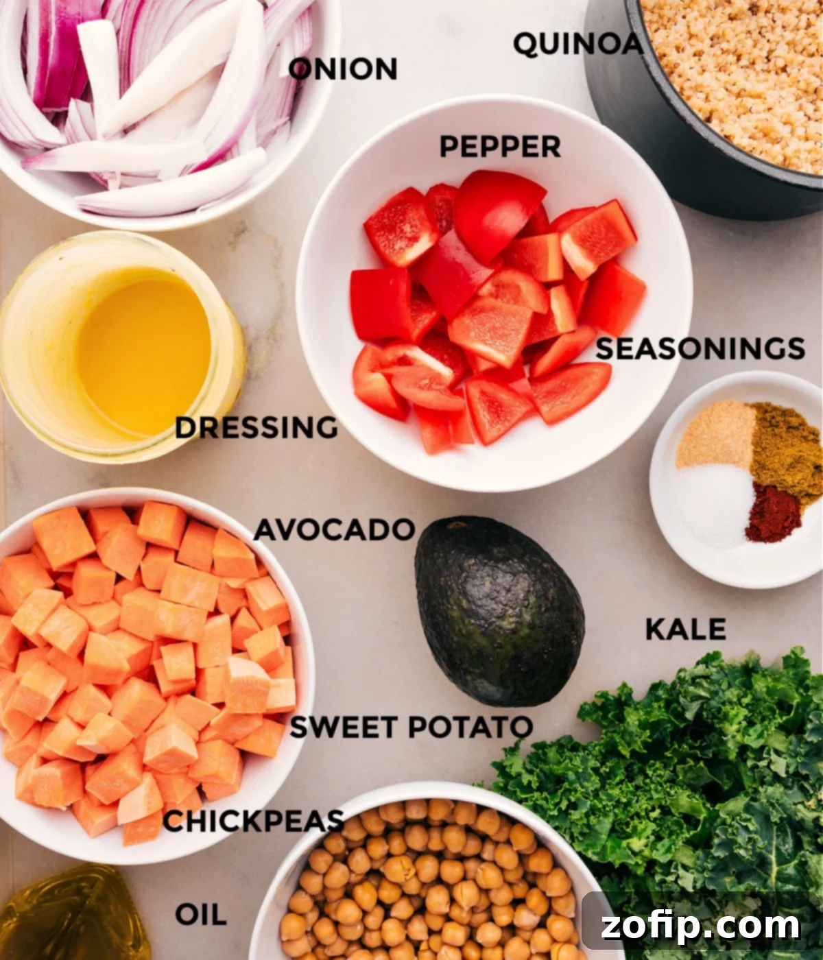 Fresh and Wholesome Ingredients for a Delicious Buddha Bowl A collection of fresh, prepped ingredients for a Buddha Bowl, including chopped sweet potatoes, sliced red onion, red pepper, a can of chickpeas, a bowl of uncooked quinoa, a bottle of olive oil, and various spices.