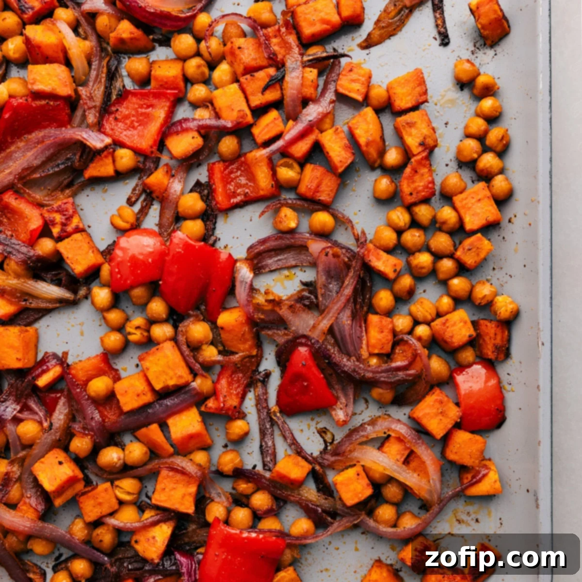Healthy Weeknight Dinner: Roasted Vegetables for Buddha Bowls A sheet pan showcasing an abundance of roasted vegetables and chickpeas, golden and tender, perfect for a healthy and satisfying weeknight dinner.