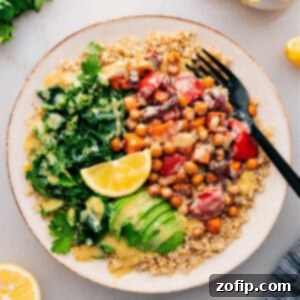 Vibrant Nourish Bowl 2 A perfectly assembled Buddha Bowl with roasted vegetables, crispy chickpeas, quinoa, and fresh greens.