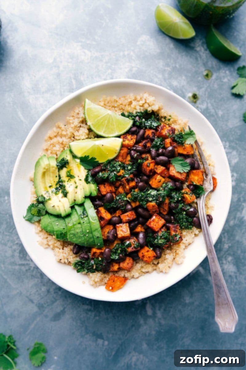 Deliciously Vibrant Sweet Potato Buddha Bowl - Colorful and Ready for a Healthy Meal A colorful and beautifully arranged sweet potato Buddha bowl, drizzled with dressing and ready to be enjoyed as a healthy meal.