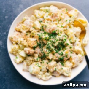 Ultimate Potato Salad 2 Fully dressed dish coated in a rich, creamy dressing.