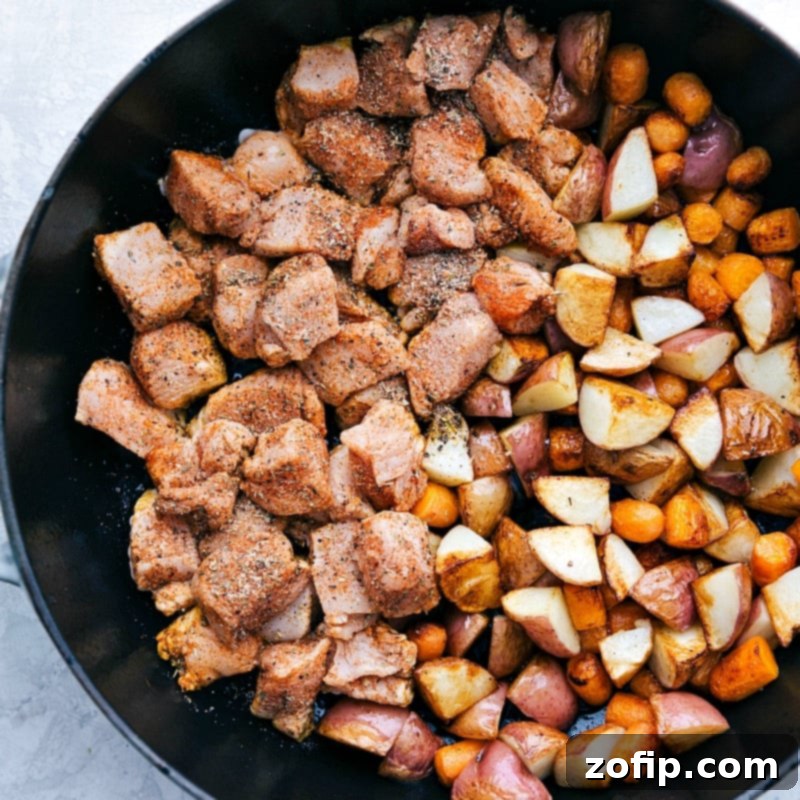 This easy lemon chicken and potatoes dish can be ready in 30 minutes or less, highlighting quick prep and cooking. Cooked Lemon Chicken, Red Potatoes, and Carrots simmering in a skillet, ready to be served