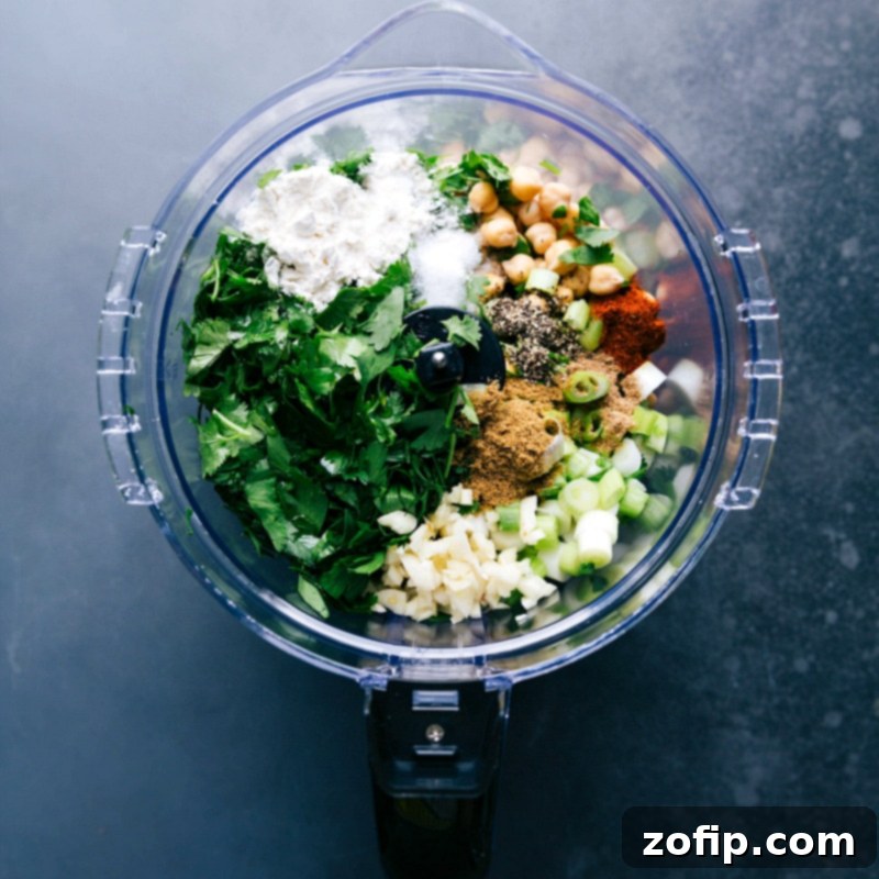 Preparing Falafel Recipe: Combining Ingredients in Food Processor Making falafel by adding all ingredients into a food processor as part of the falafel recipe preparation.