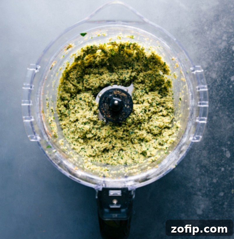 Blended Falafel Ingredients in Food Processor, Ready to Bake All ingredients in a food processor, blended and ready for baking.
