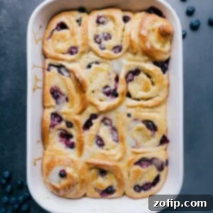 Bright Lemon Blueberry Rolls 2 Scrumptious lemon-blueberry sweet rolls, a delectable pastry treat.