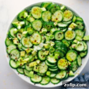 Asian Cucumber Salad in a bowl ready to be enjoyed, showcasing its fresh ingredients and inviting colors.