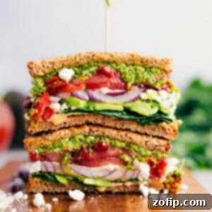 Easy, vegetarian Mediterranean Sandwich—pile veggies, creamy feta cheese, and basil pesto on hearty bread.