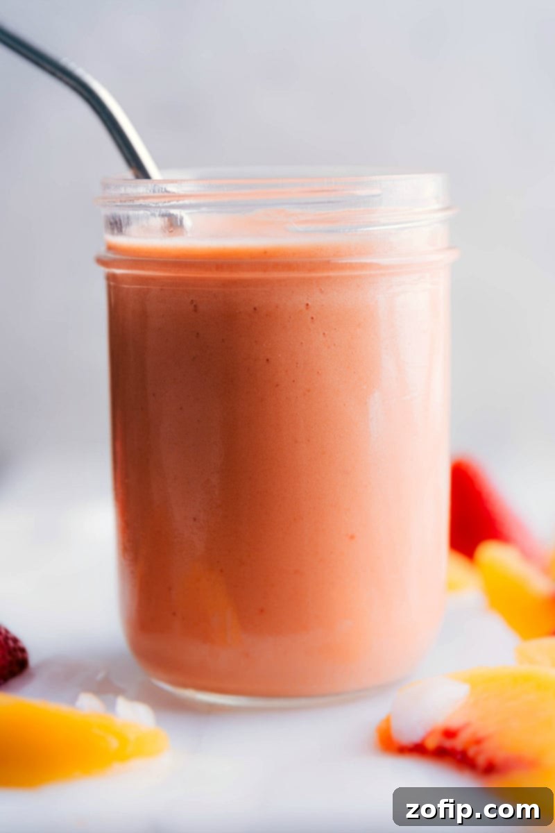 Refreshing Peach Smoothie A vibrant and refreshing Peach Smoothie served in a glass, ready to be enjoyed.