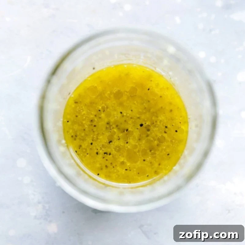 Homemade Lemon Dressing - Perfect Accompaniment for Orzo Pasta Salad Delicious homemade lemon dressing prepared for the recipe.