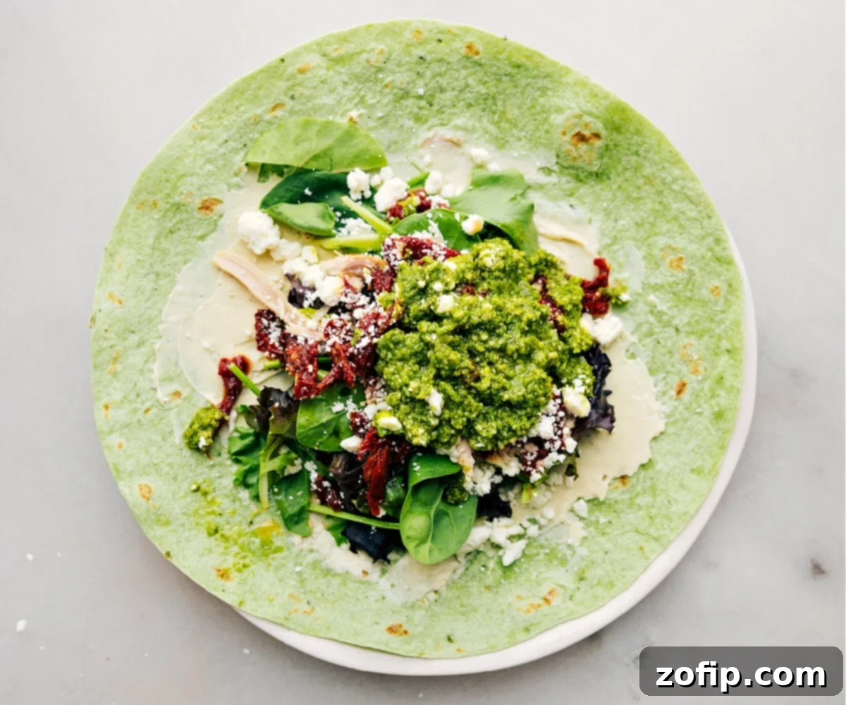 How To Make Mediterranean Wraps Recipe All ingredients for the Mediterranean Wrap neatly assembled inside a tortilla, spread out and ready to be rolled into a delicious meal.