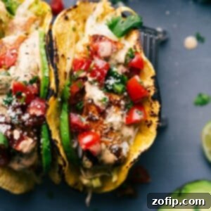 Ocean Fresh Tacos 2 Two fish tacos stuffed with delicious toppings, ready to be savored.