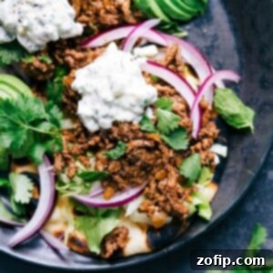 Spiced Naan Beef Wraps 2 Ground beef naan tacos with all the toppings, a delicious meal with complimentary flavors ready to be enjoyed.