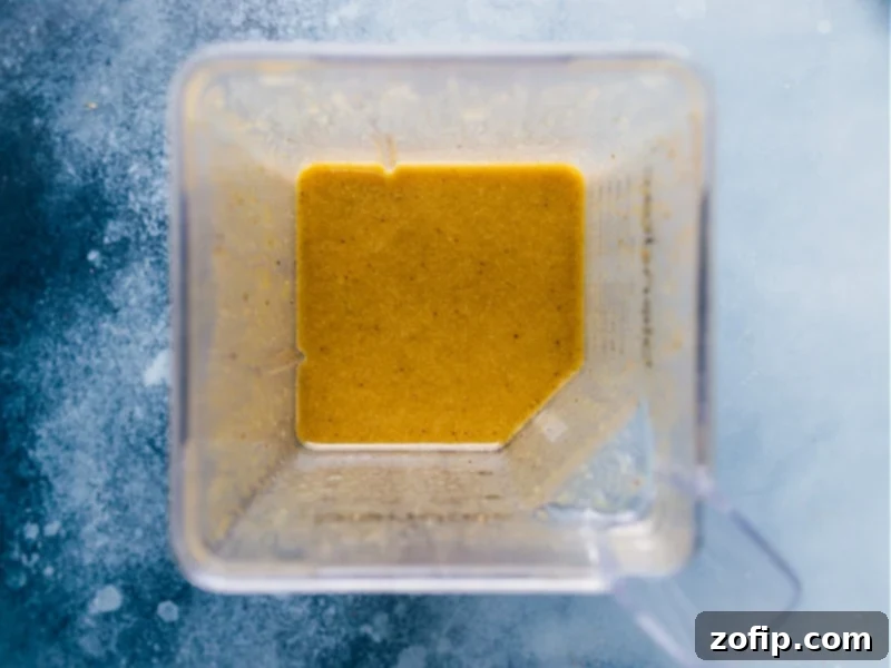 A closer view of the beautifully arranged Cobb Salad, showcasing its colorful layers of ingredients.