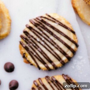 Shortbread cookies with a tempting chocolate drizzle, perfect for sharing.