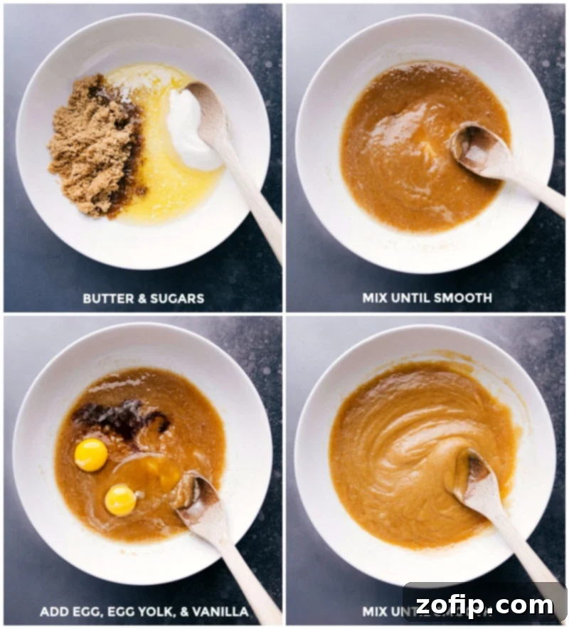 Mixing Butter, Sugars, Eggs, and Vanilla Combining butter and sugars in a mixing bowl, mixing until smooth, then adding egg, yolk, and vanilla, and mixing again until the mixture is smooth and creamy.