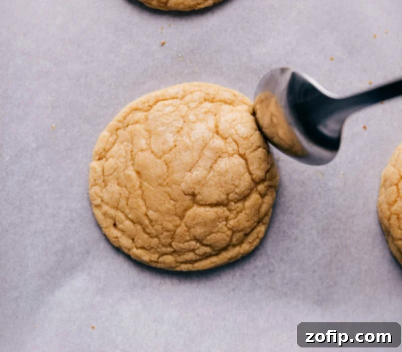 Shaping Cookies for Crispy Edges Using the back of a spoon to push in the edges of just-baked cookies, creating crispy edges while the cookies are still warm.