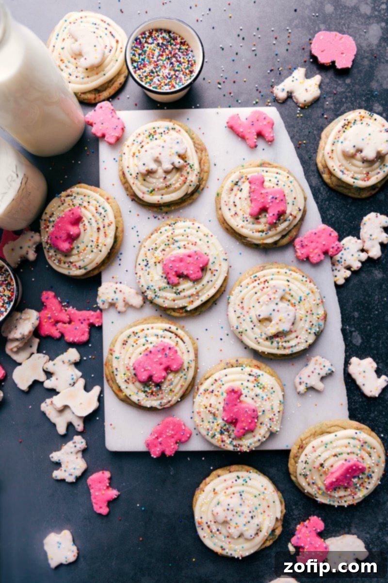 Deliciously decorated Circus Animal Cookies, vibrant with rainbow sprinkles and topped with frosted animal crackers, perfect for any celebration.