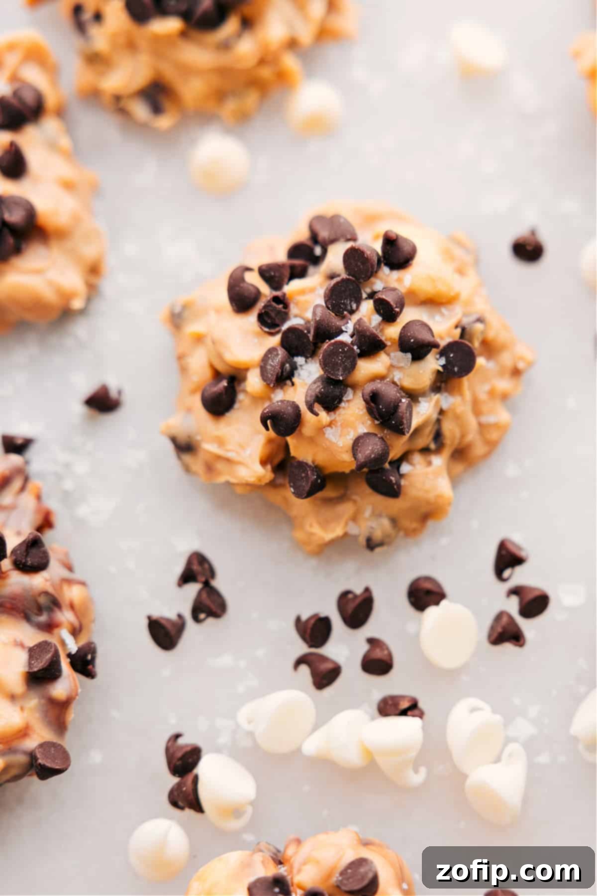 Quick No Bake Avalanche Cookies 2 Delicious no-bake Avalanche Cookies generously sprinkled with chocolate chips, showcasing their irresistible texture.