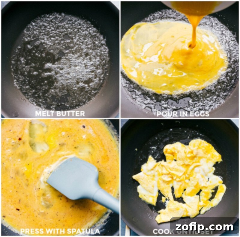 Eggs Being Fried in a Skillet with Butter, Cooking to Perfection. Eggs gently cooking in a large non-stick skillet with melted butter, beginning to set around the edges.