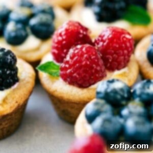 Sweet Mini Fruit Tart Delights 3 Mini fruit tarts topped with raspberries, blueberries, blackberries, and fresh mint.