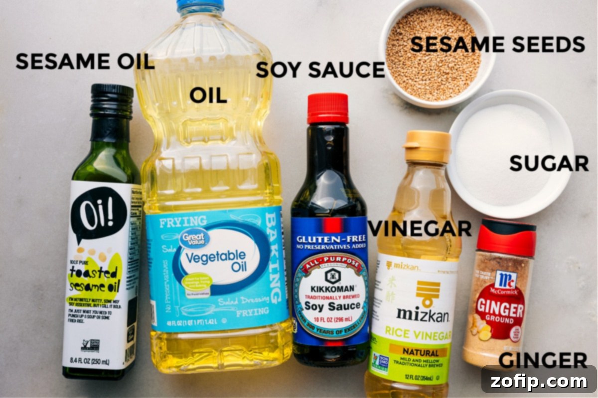 Essential Dressing Ingredients for Asian Pasta Salad All the dressing ingredients neatly prepped and ready for mixing: individual bowls of sesame oil, vegetable oil, soy sauce, rice vinegar, sesame seeds, sugar, and ground ginger, creating a vibrant display of flavors.