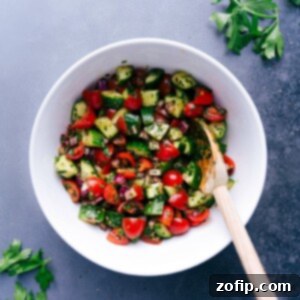 Fresh Israeli salad in a serving bowl with vibrant vegetables and herbs.