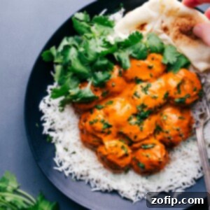 Plate of Butter Chicken Meatballs on rice with naan