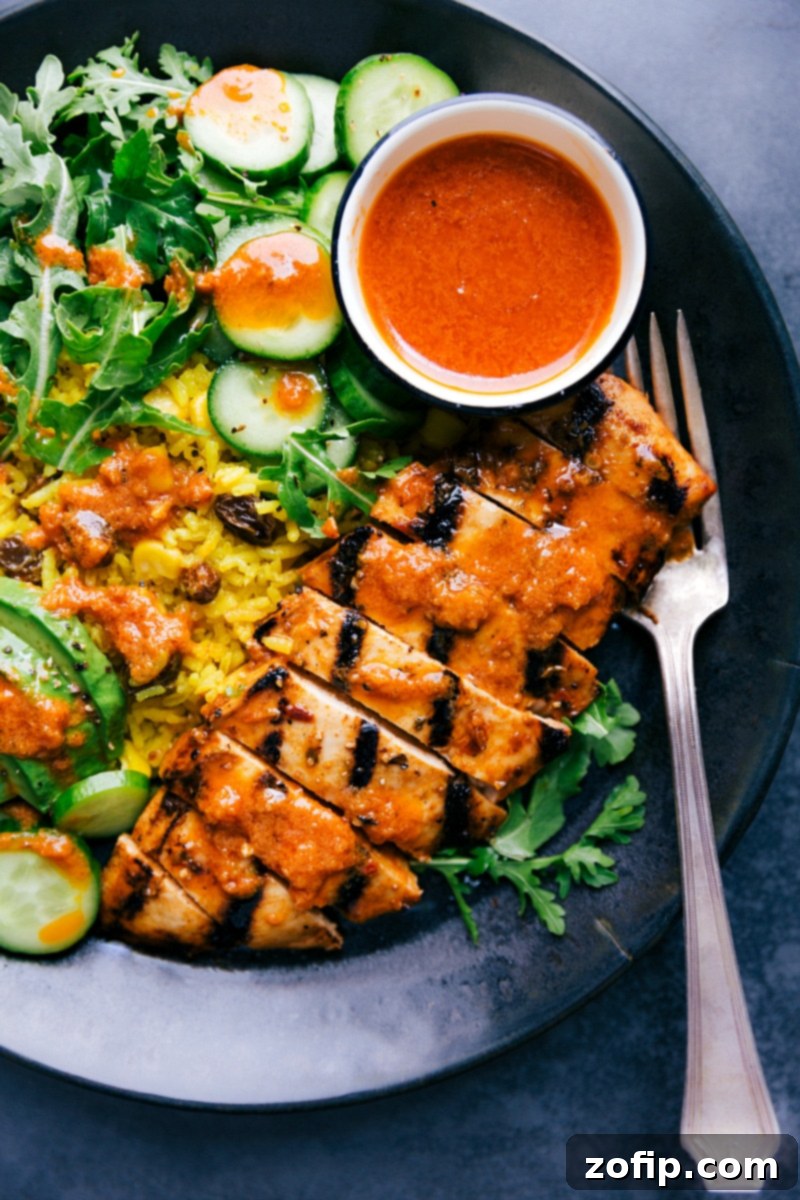 Delicious Chicken and Yellow Rice bowl served Finished Chicken and Yellow Rice bowl on a plate, ready to be enjoyed