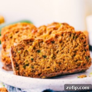 Wholesome Zucchini Loaf 2 Healthy Zucchini Bread with slices on a wooden board