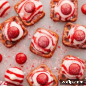 Peppermint Bark Pretzel Bites 2 A festive close-up of a finished Peppermint Bark Pretzel, showcasing its sweet and salty appeal.