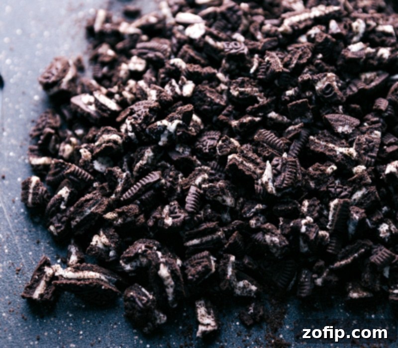 A close-up view of coarsely chopped Oreo cookies, ready to be incorporated into the homemade fudge recipe.