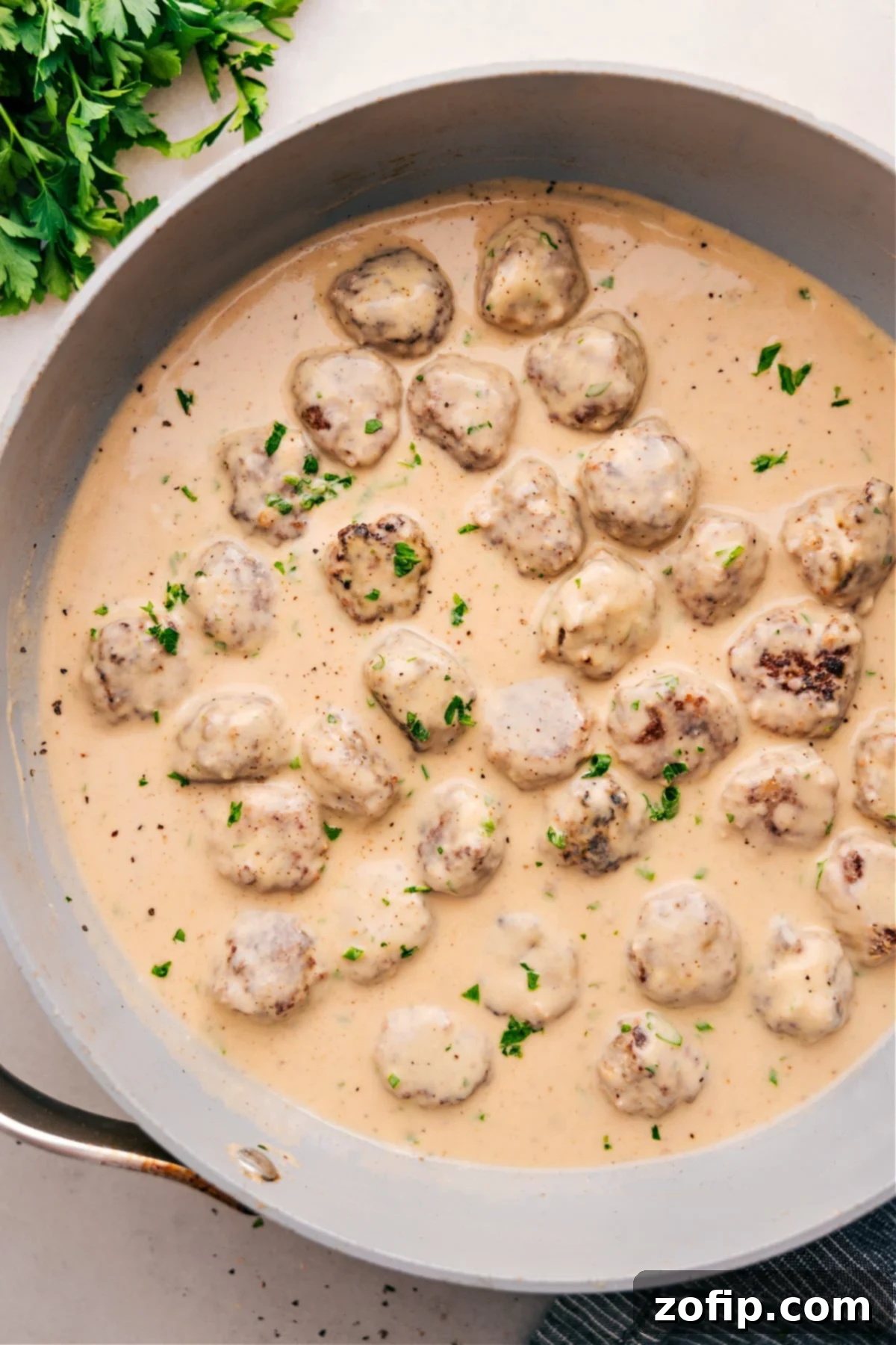 The Best Swedish Meatballs Recipe: Tender Meatballs in Creamy Gravy Homemade Swedish Meatballs simmering gently in a rich, creamy brown sauce, ready to be served.