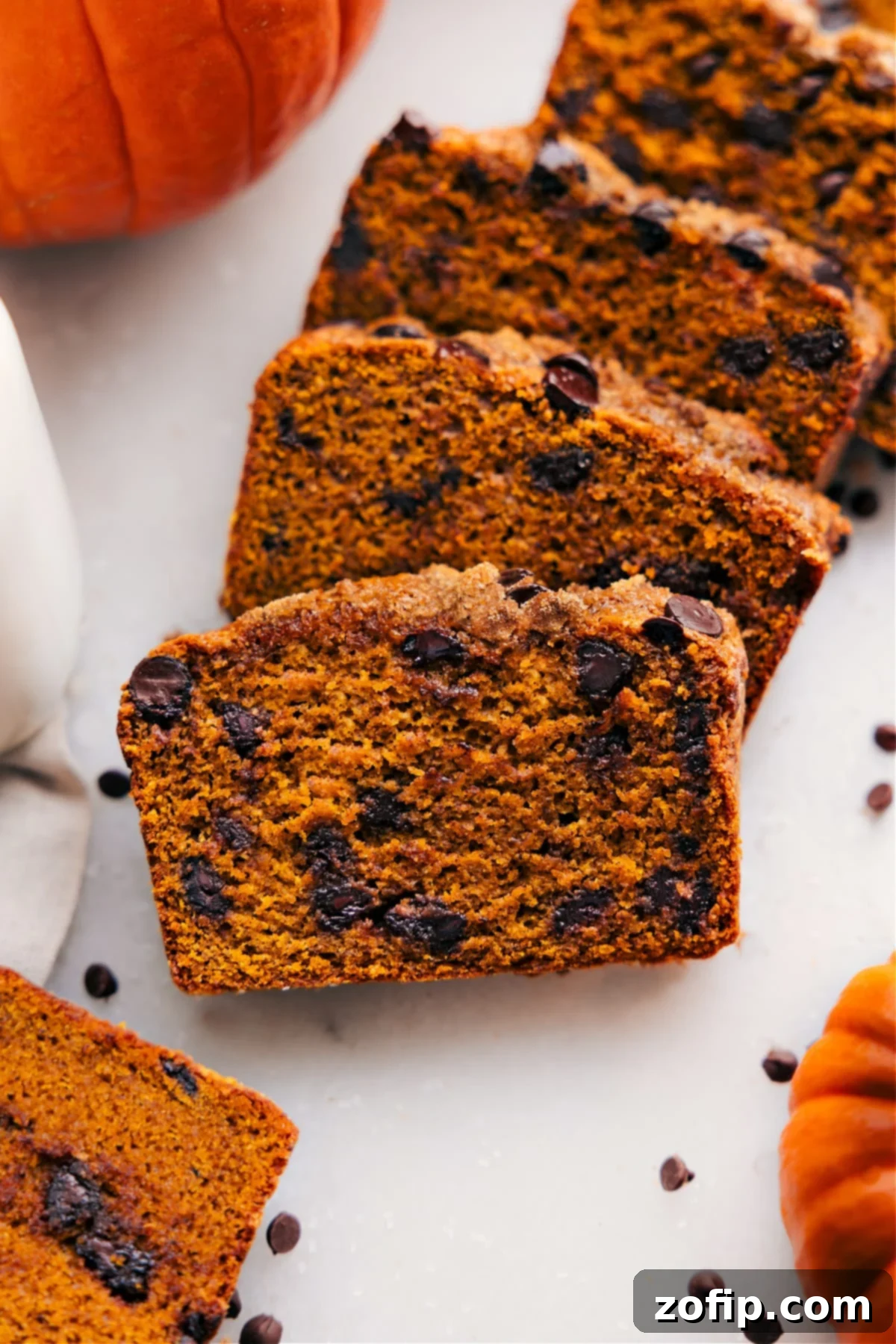 Moist and flavorful healthy pumpkin bread slices, packed with nutritious ingredients and fall spices.